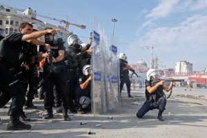 Turkish riot police fire teargas at protesters at Taksim Square on Tuesday. (Reuters: Yannis Behrakis