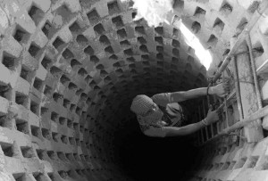   A Hamas operative climbing upward in a pier of one of the major tunnels.  Notice the work on the sides of the tunnel. 